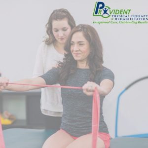 Physical therapist guiding a patient through resistance band exercises