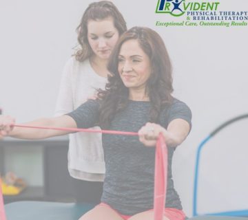 Physical therapist guiding a patient through a resistance band exercise